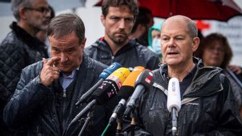  In this Tuesday, Aug.3, 2021 file photo Armin Laschet, top canditate of the German Christian Democrats for the federal elections, and Olaf Scholz, top canditate of the German Social Democrats, address the media during a press conference in Stolberg, Germany that was hit by heavy rain and floods. A large chunk of the German electorate remains undecided going into an election that will determine who succeeds Angela Merkel as chancellor after 16 years in power. Photo: Marius Becker/AP/TT