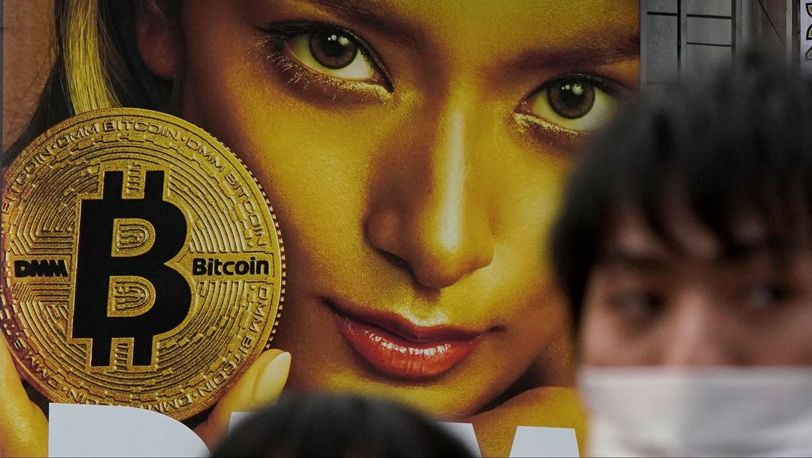 A huge advertisement of Bitcoin is displayed near Shibuya train station in Tokyo, 2018. In Hungary a statue of the mysterious Bitcoin developer Satoshi Nakamoto was unveiled this week. Since Nakamoto’s true identity is unknown, the statue has a bust with a featureless face wrapped in a bronze hoodie emblazoned with the Bitcoin logo that is heavily polished to make it reflective like a mirror in which viewers can see themselves. Photo: Shizuo Kambayashi/AP/TT