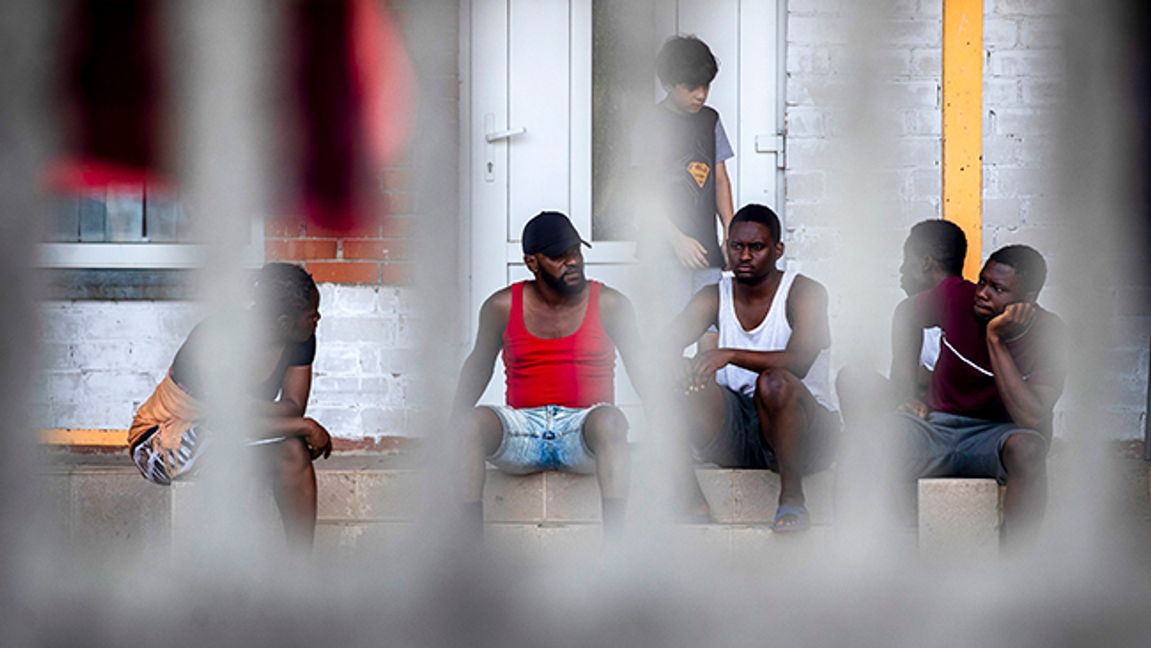 Migrants rest at the refugee camp in Druskininkai, some 145km (99,1 miles) south from Vilnius, Lithuania, Tuesday, July 13, 2021. Lithuania has struggled with a flow of migrants from the Middle East and Africa — a huge influx that officials in the tiny Baltic country say was organized by Belarusian authorities as part of a ”hybrid war” against the European Union. Photo: Mindaugas Kulbis/AP