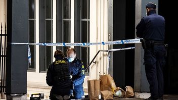Polisens kriminaltekniker i arbete efter tisdagskvällens mord i Lund. Bild: Johan Nilsson/TT