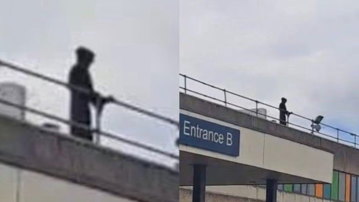 Liemannen stirrade ned mot personal och patienter från sjukhustaket. Foto: Skärmdumpar X