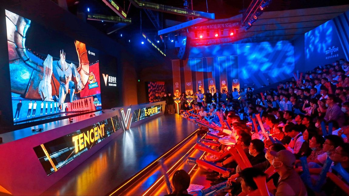 Fans watch the match of the 2020 League of Legends World Championship televised on a screen at a Tencent V-station in Shanghai, China, Oct. 31, 2020. Hugely popular online games and celebrity culture are the latest targets in the ruling Communist Party’s campaign to encourage China’s public to align their lives with its political and economic goals. Photo: Chinatopix via AP/TT