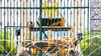 Barbed wire and a military armored personnel carrier block a side entrance of the Tunisian parliament in Tunis, Tuesday, July 27, 2021. The Ennahda party, has called for dialogue, following President Kais Saeid’s sacking of the prime minister and suspension of parliament on Sunday. Photo: Hassene Dridi/AP