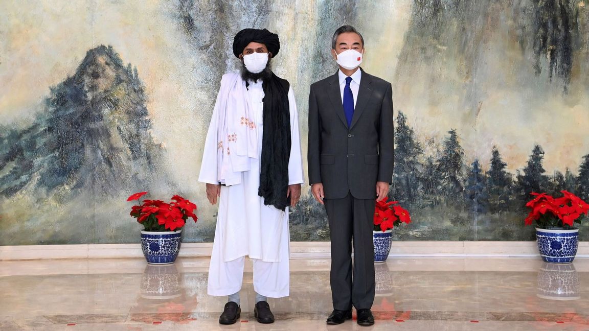 In this July 28, 2021, file photo released by China’s Xinhua News Agency, Taliban co-founder Mullah Abdul Ghani Baradar, left, and Chinese Foreign Minister Wang Yi pose for a photo during their meeting in Tianjin, China. In the U.S. departure from Afghanistan, China has seen the realization of long-held hopes for a reduction of the influence of a geopolitical rival in what it considers its backyard. Yet, it is also deeply concerned that the very withdrawal could bring instability to that backyard - Central Asia - and possibly even spill over the border into China itself in its heavily Muslim northwestern region of Xinjiang. Photo: Li Ran/Xinhua via AP/TT