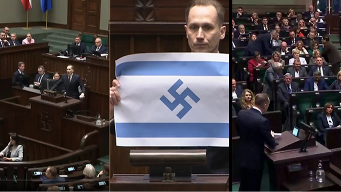 Konrad Berkowicz visar upp flaggan i talarstolen. Fakismil: Youtube