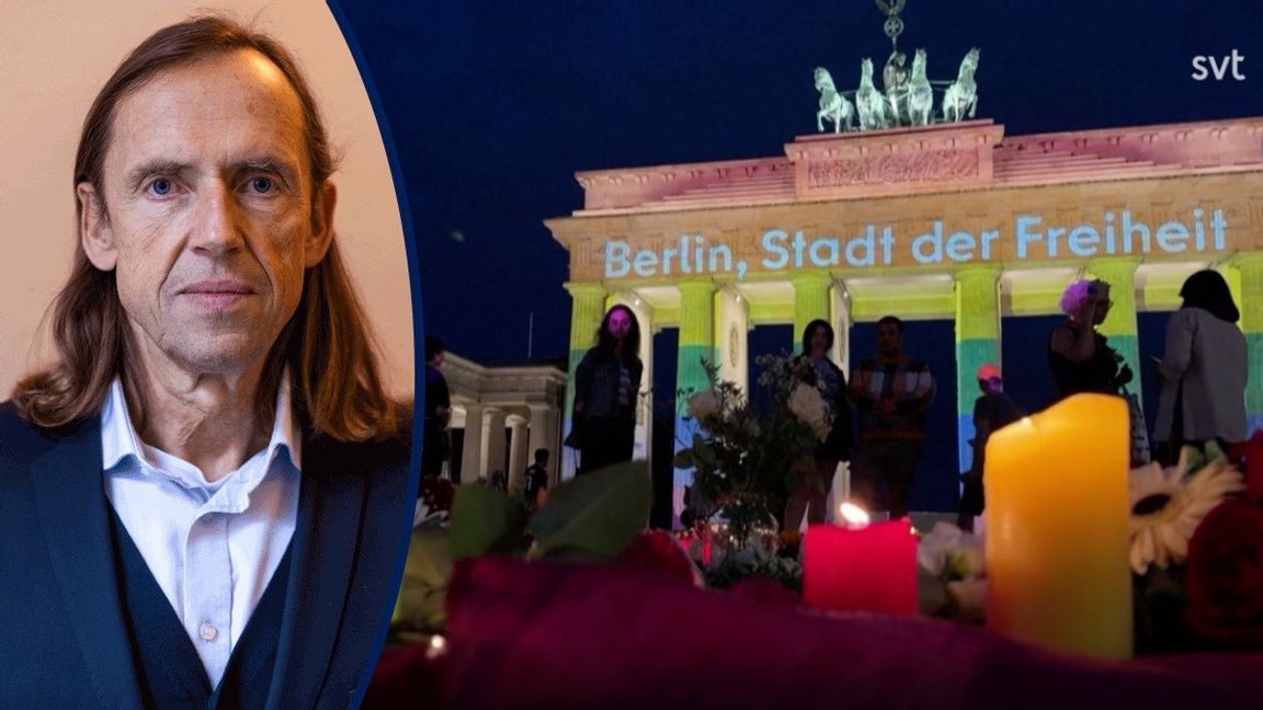 Tända ljus framför Brandenburger Tor efter terrordådet i Berlin. Foto: Skärmavbild från SVT