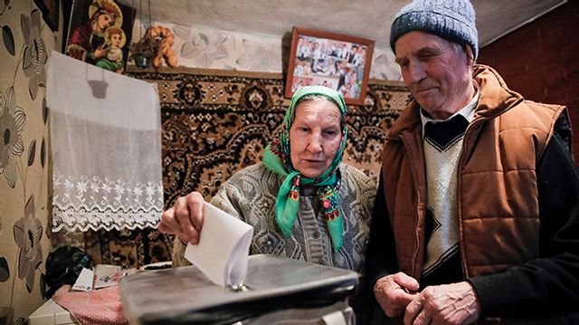 A woman casts her vote in a mobile ballot box in the village of Stolniceni, Moldova, the last time there were a parliamentary election, in February 2019. Photo: Vadim Ghirda/AP