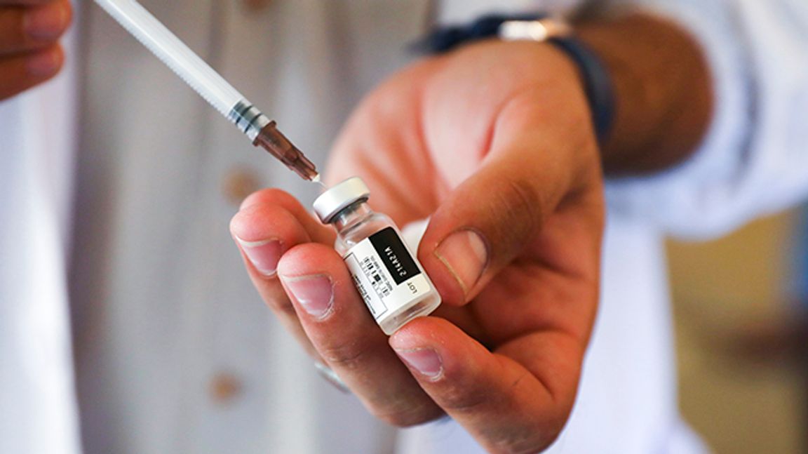 In this Sunday, July 11, 2021 file photo, a doctor fills a syringe with the Johnson & Johnson COVID-19 vaccine at a vaccination center in Kabul, Afghanistan. Top officials at the World Health Organization said Monday, July 12 there is not enough evidence to show that third doses of coronavirus vaccines are needed and appealed for the scarce shots to be shared with poor countries who have yet to immunize their populations instead of being used by rich countries as boosters. Photo: Rahmat Gul/AP