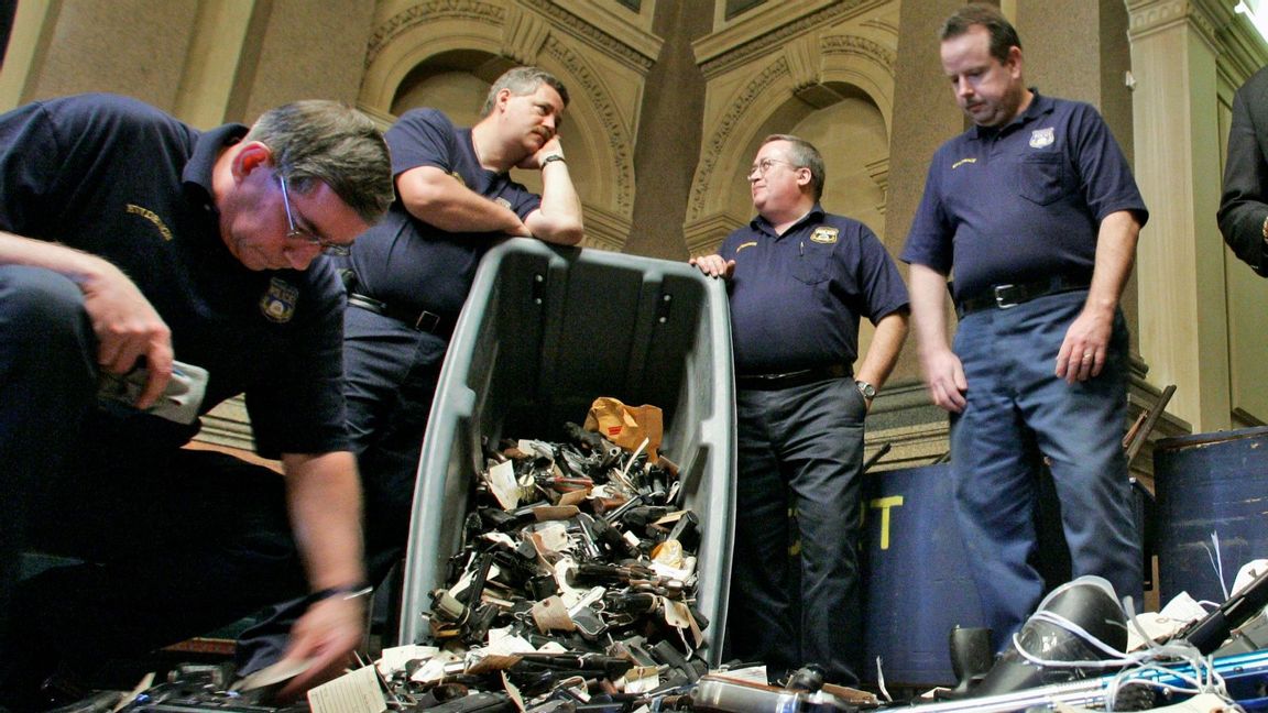 Some of the handguns collected in Philadelphia’s 2007 ”Groceries for Guns Exchange” program. This week the Philadelphia Enquirer wrote ”There’s only been one day so far this year — Jan. 2 — when not a single person was shot in the city.” Photo: George Widman/AP/TT