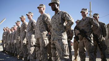 In this Jan. 15, 2018 file photo, U.S. Marines stand guard during the change of command ceremony at Task Force Southwest military field in Shorab military camp of Helmand province, Afghanistan. Photo: Massoud Hossaini/AP