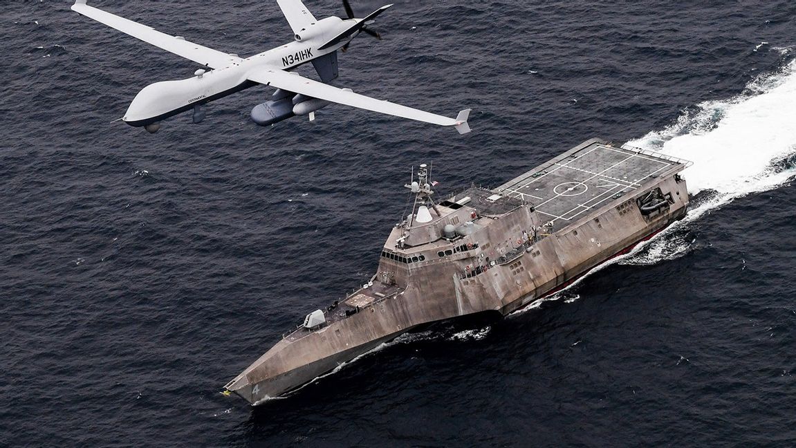 In this handout image from the U.S. Navy, an MQ-9 Sea Guardian unmanned maritime surveillance drone flies over the USS Coronado in the Pacific Ocean during a drill April 21, 2021. The U.S. Navy’s Mideast-based 5th Fleet said Wednesday, Sept. 8, 2021, it will launch a new task force that incorporates airborne, sailing and underwater drones after years of maritime attacks linked to ongoing tensions with Iran. Photo: U.S. Navy/Chief Mass Communication Specialist Shannon Renfroe, via AP/TT