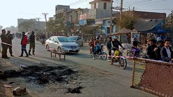Mannen lynchades utanför fabriken han drev i Sialkot, Pakistan. Foto: Shahid Akram/AP/TT.