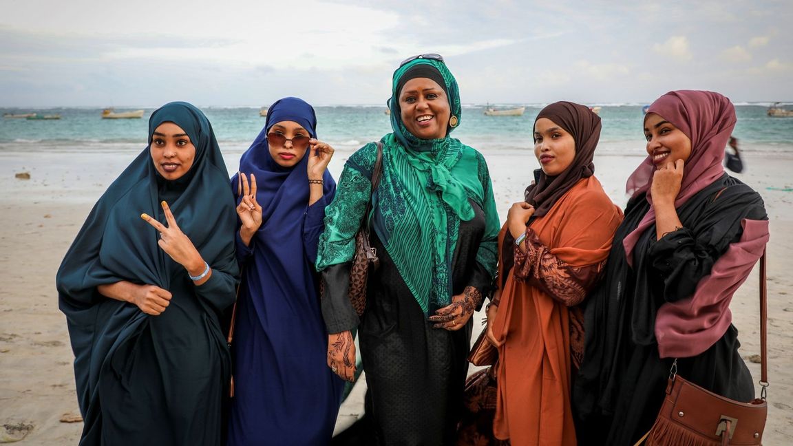 Somali Parliament member Fawzia Yusuf H. Adam, center, chats with campaign supporters at Lido beach in Mogadishu, Somalia Monday, July 19, 2021. The woman who broke barriers as the first female foreign minister and deputy prime minister in culturally conservative Somalia now aims for the country’s top office as the country moves toward a long-delayed presidential election. Photo: Farah Abdi Warsameh/AP/TT